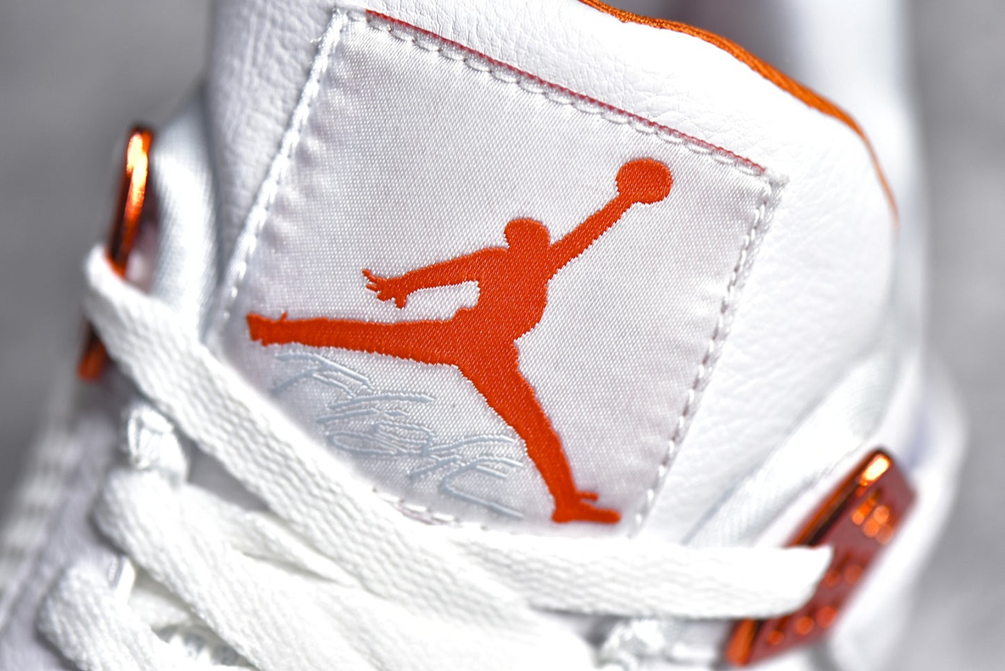 Jordan 4 Metallic Orange